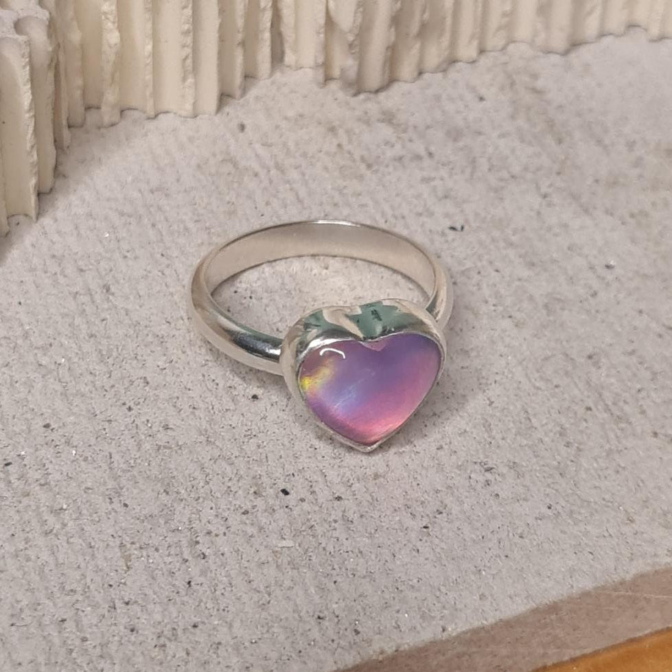 Sterling silver ring with heart shaped aurora opal bezel set