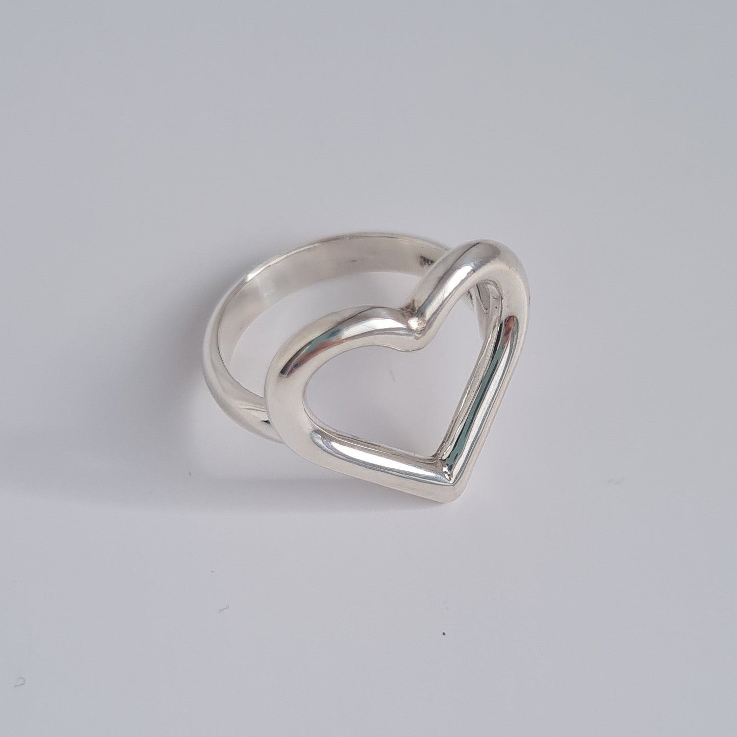 silver open heart shaped ring with d shaped band