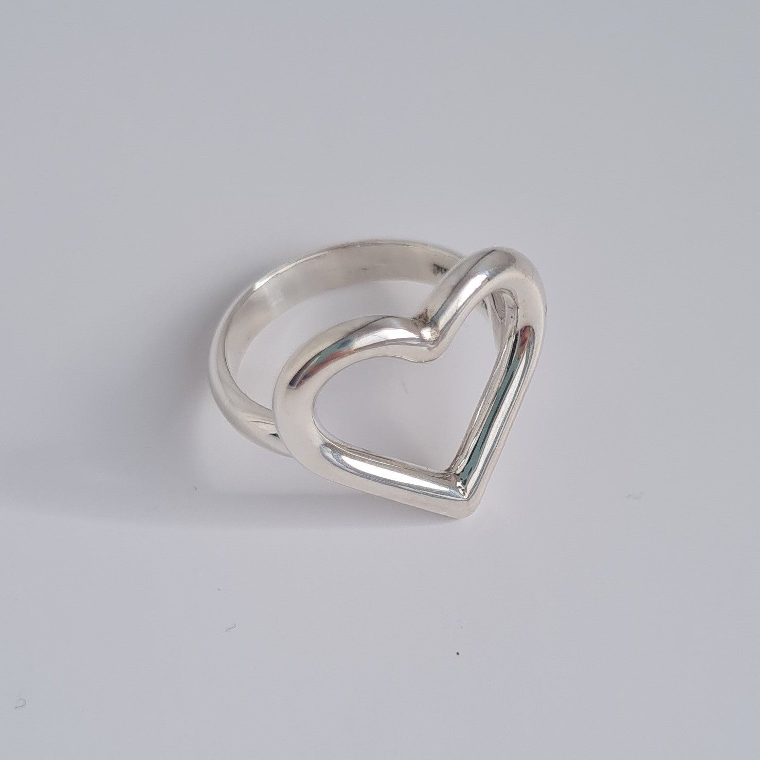 silver open heart shaped ring with d shaped band