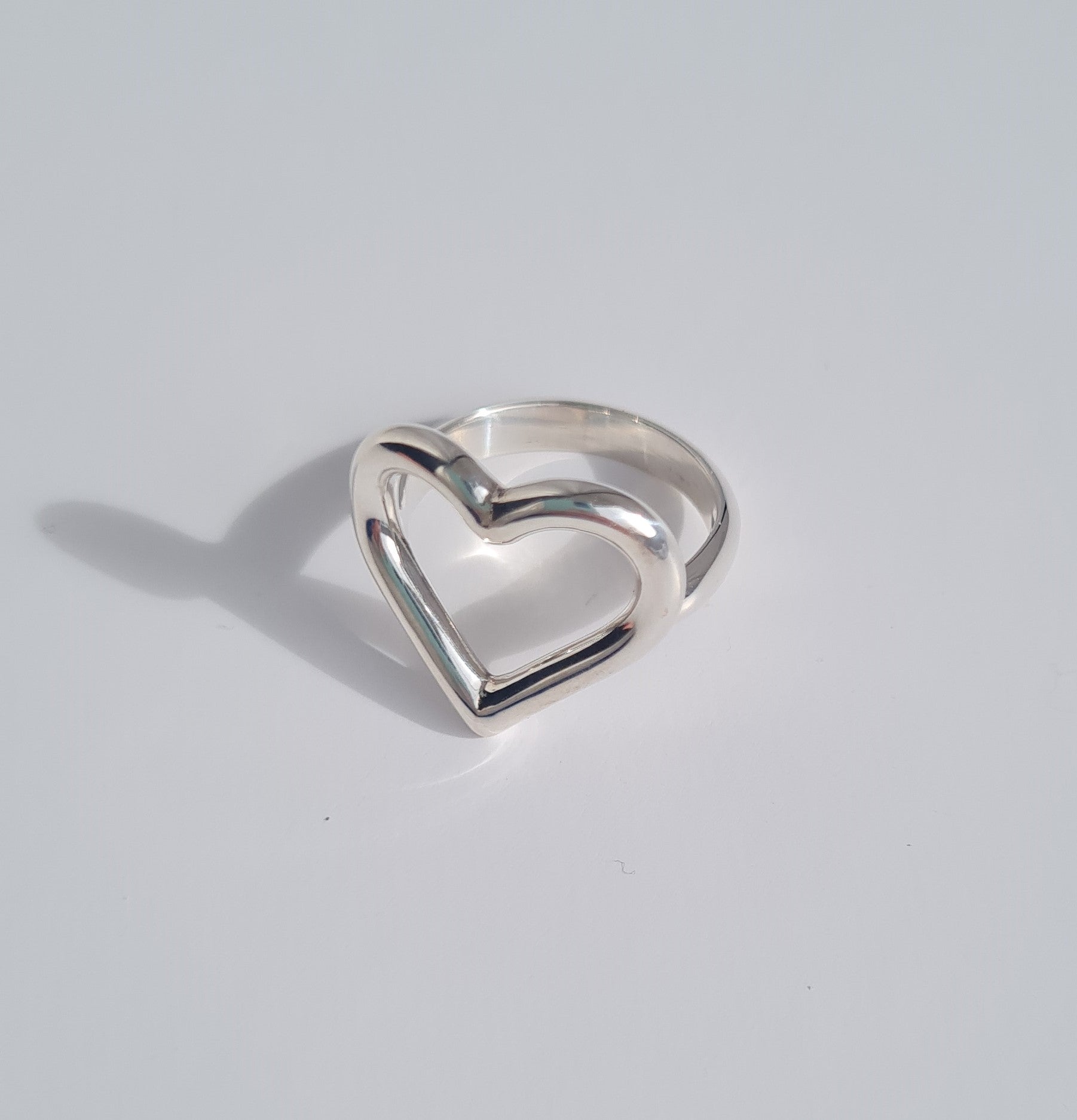 silver open heart ring with d-shaped band