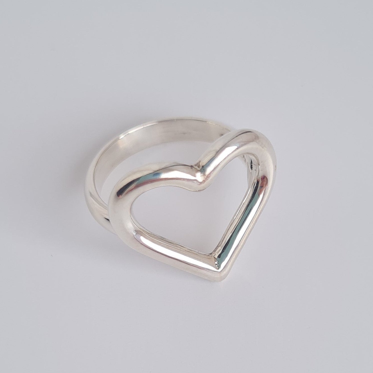 silver open heart ring on d-shaped band