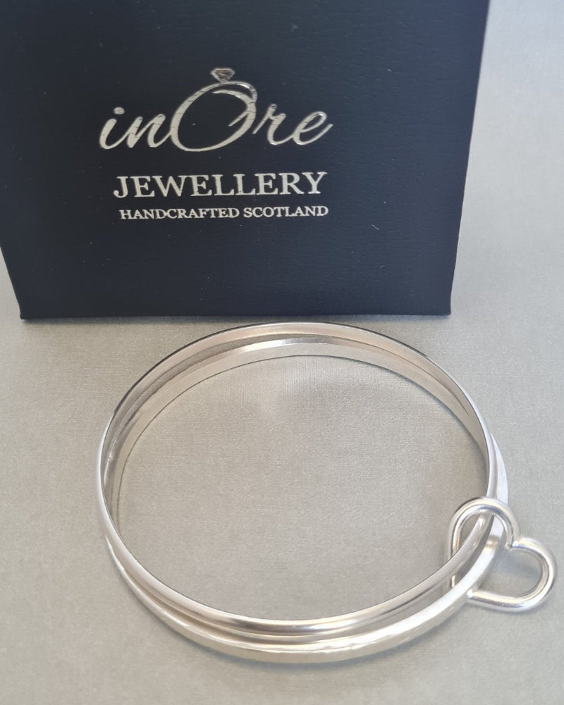 sterling silver handmade stacking bangle with silver heart charm, with inOre Jewellery branded gift box